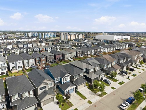 Residential neighborhood featuring a variety of detached homes with attached garages, paved driveways, and landscaped front yards - 9323 223 Street, Edmonton, AB 