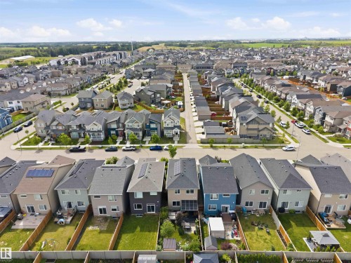 Aerial perspective of a developed residential community featuring detached homes with varied exterior finishes and rooflines - 9323 223 Street, Edmonton, AB 