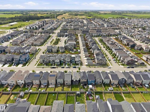 Aerial rendering of a residential development featuring rows of single-family homes with pitched roofs - 9323 223 Street, Edmonton, AB 