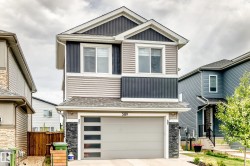 Two-story residence featuring a combination of horizontal siding, vertical board and batten siding, and stone accents - 