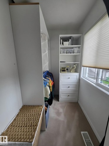 White custom shelving unit with three drawers and polished hardware - 13 Baie Madelene, Beaumont, AB 