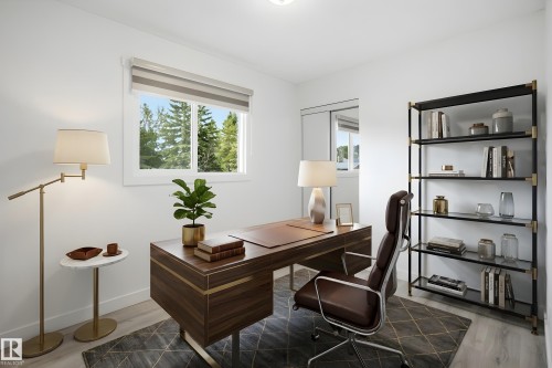 Bright room featuring a window with integrated blinds, light wood-finish flooring, and a mirrored closet door - 3548 20 Ave, Edmonton, AB 