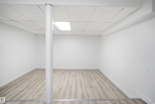 Bright interior space featuring light wood-finish flooring - 3548 20 Ave, Edmonton, AB 