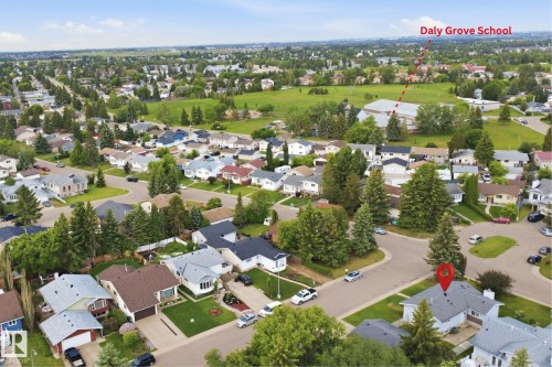 Residential neighborhood featuring mature trees, paved streets, and a mix of single-family homes - 3548 20 Ave, Edmonton, AB 