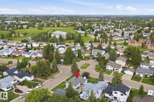 Residential neighborhood with detached homes, mature trees, and green spaces - 3548 20 Ave, Edmonton, AB 