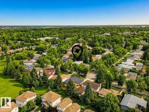 Residential neighborhood featuring mature trees and a clear sky - 24 Addison Crescent, St. Albert, AB 