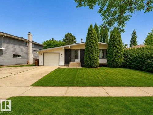 Ranch-style residence featuring a prominent front lawn and mature landscaping - 24 Addison Crescent, St. Albert, AB 