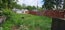 Expansive rear yard area featuring mature perimeter trees and a privacy fence - 12741 117 Street Nw, Edmonton, AB 