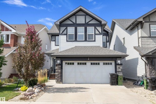 Two-story exterior with light gray siding and dark trim accents - 363 Cy Becker Boulevard, Edmonton, AB - Outdoor With Facade