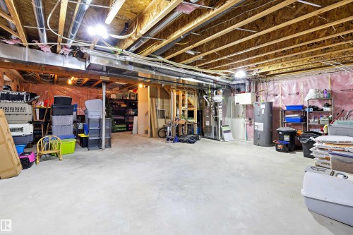 Unfinished basement with concrete flooring and exposed ceiling joists - 363 Cy Becker Boulevard, Edmonton, AB - Indoor Photo Showing Basement