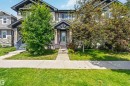 Townhome exterior featuring horizontal siding and stone accents - 940 East Gate, Edmonton, AB 