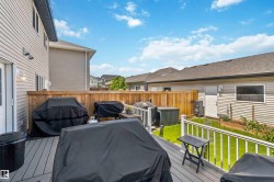 Expansive outdoor deck featuring composite decking and white railings - 