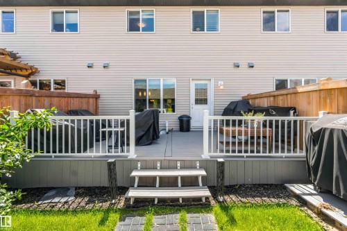 Expansive composite deck featuring white railings and dual-level access - 940 East Gate, Edmonton, AB 