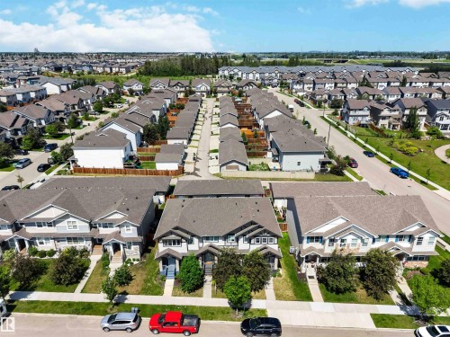 Residential community featuring a variety of two-story homes with pitched roofs and front yard landscaping - 940 East Gate, Edmonton, AB 