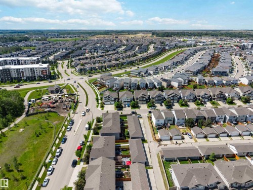 Aerial perspective of a developed residential area featuring a mix of detached homes and multi-story apartment buildings - 940 East Gate, Edmonton, AB 