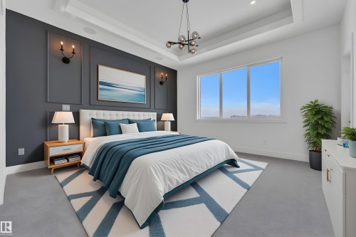 Tray ceiling bedroom featuring a dark accent wall with decorative molding and wall sconces - 501 Creekside Bay, Leduc, AB 