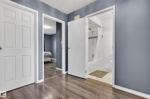 Wood-finish flooring extending into multiple rooms - 13445 40 Street Nw, Edmonton, AB 
