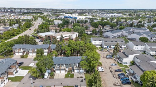 Aerial perspective of a developed residential area with multiple townhouse complexes and surrounding infrastructure - 13445 40 Street Nw, Edmonton, AB 
