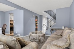 Interior space featuring light blue walls and wood-finish flooring - 