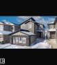 Property Exterior. Depicting the property's facade with a garage featuring window coverings and surrounding environmental conditions - 3722 41 Avenue, Beaumont, AB 