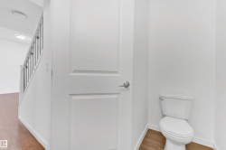 White paneled interior door with brushed nickel hardware - 