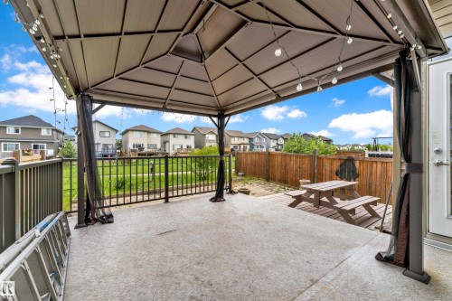 Spacious concrete patio with a permanent gazebo structure - 5432 20 Avenue, Edmonton, AB 