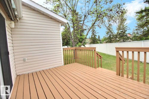 Expansive wood deck with two-tier railing system - 8146 27 Avenue, Edmonton, AB - Outdoor With Deck Patio Veranda With Exterior