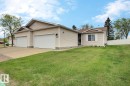 Ranch-style residence featuring light-colored siding and a brown shingle roof - 8146 27 Avenue, Edmonton, AB  - Outdoor 