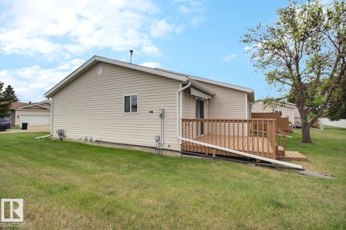 Spacious outdoor deck with natural wood railing and steps - 8146 27 Avenue, Edmonton, AB - Outdoor With Deck Patio Veranda With Exterior