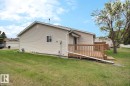 Spacious outdoor deck with natural wood railing and steps - 8146 27 Avenue, Edmonton, AB  - Outdoor With Deck Patio Veranda With Exterior 