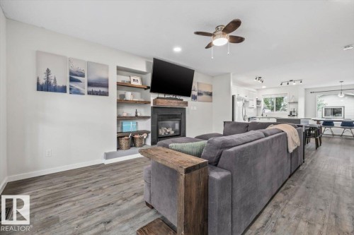 12122 17 Avenue, Edmonton, AB - Indoor Photo Showing Living Room With Fireplace
