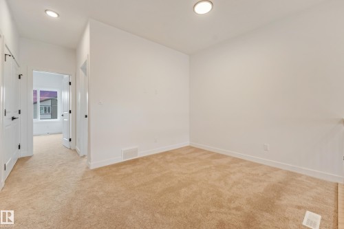 Neutral-toned carpeting throughout - 4636 18 Avenue, Edmonton, AB 