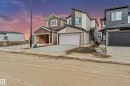 Contemporary two-story exterior with varied siding, a single-car garage, and a concrete driveway - 4636 18 Avenue, Edmonton, AB 