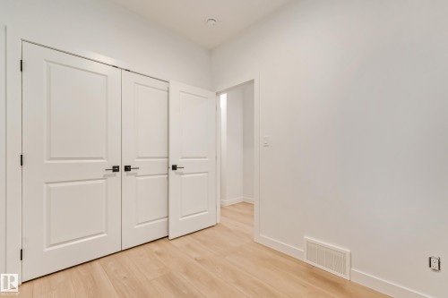 Bright interior space featuring light wood-finish flooring - 4636 18 Avenue, Edmonton, AB 