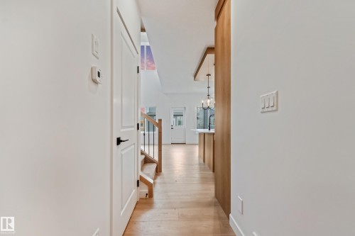 Light wood-finish flooring extending throughout the space - 4636 18 Avenue, Edmonton, AB 