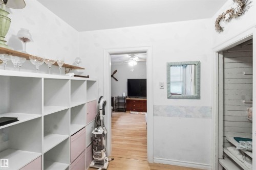 White interior walls complement the wood-finish flooring - 12016 61 Street, Edmonton, AB 