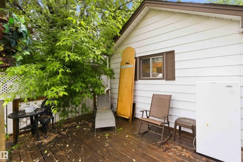 Exterior deck with white siding and brown trim - 12016 61 Street, Edmonton, AB 
