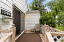 Exterior siding with a sliding glass door and outdoor lighting - 12016 61 Street, Edmonton, AB 