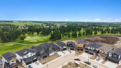 New construction residences with modern architectural designs and attached garages - 