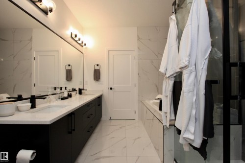 Spacious bathroom featuring a double vanity. - 63 Penn Place, Spruce Grove, AB 