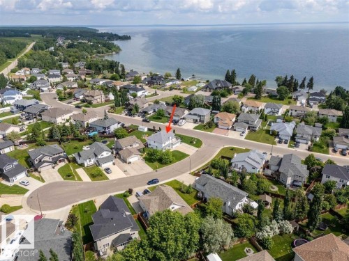 Aerial perspective showcasing a residential neighborhood with waterfront properties - 2602 Delta Road, Cold Lake, AB 