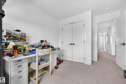 Neutral-toned carpeting and bright white walls provide a versatile backdrop - 