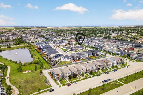 Aerial perspective showcasing a residential neighborhood with diverse housing styles - 104 Kidd Crescent, Leduc, AB 