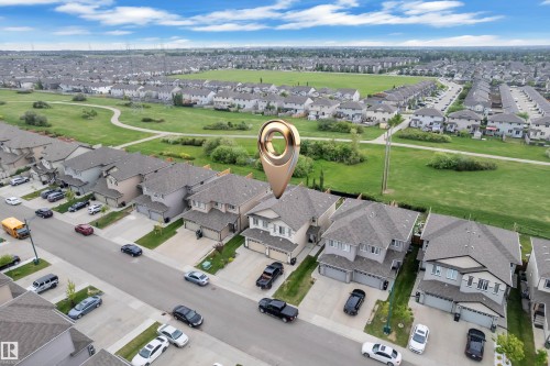 Aerial perspective showcasing a residential neighborhood with single-family homes - 1750 27 Street, Edmonton, AB 