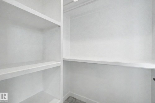 Built-in shelving with multiple storage compartments - 4 Willow Heights Drive, Stony Plain, AB 