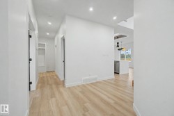 Entryway featuring wood-finish flooring and recessed lighting - 