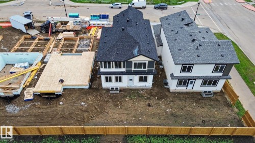 New construction homes featuring dark shingled roofs and light-toned siding - 4 Willow Heights Drive, Stony Plain, AB 