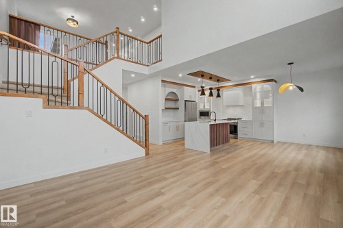 Open-concept living space with light wood-finish flooring - 4 Willow Heights Drive, Stony Plain, AB 