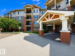 Multi-story building featuring a brick and siding exterior - 