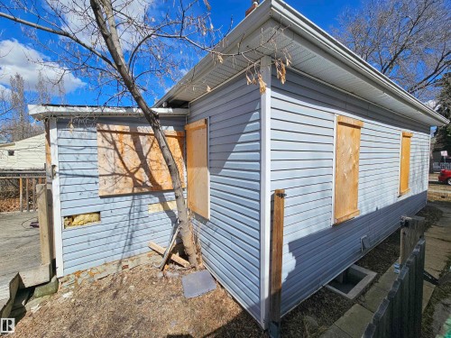 Light blue horizontal siding with white trim - 11406 88 Street, Edmonton, AB 